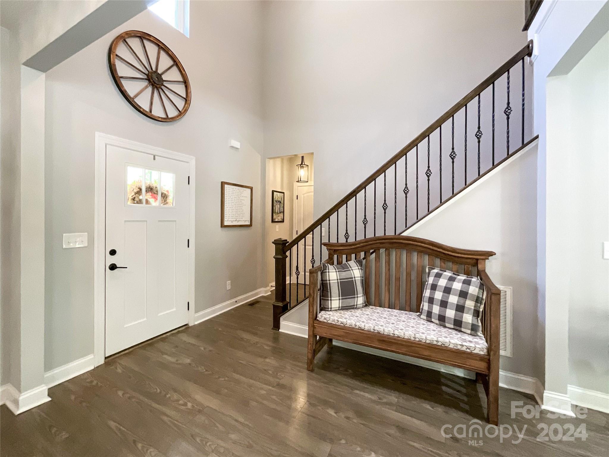 9408 Deer Run Road Waxhaw, NC 28173 - Photo 5 of 47 a view of entryway with wooden floor and stairs