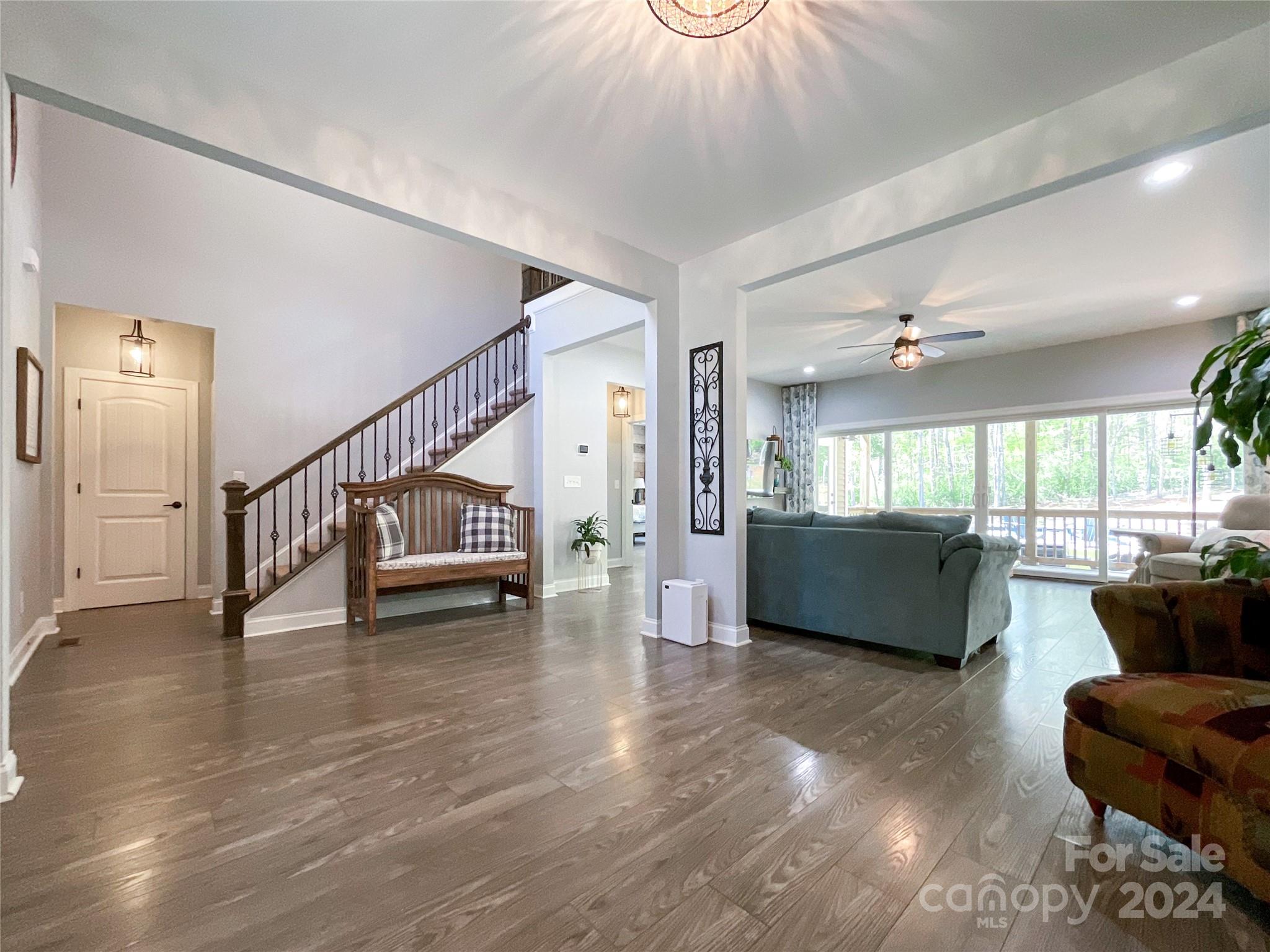 9408 Deer Run Road Waxhaw, NC 28173 - Photo 7 of 47 a view of a livingroom with furniture wooden floor and windows