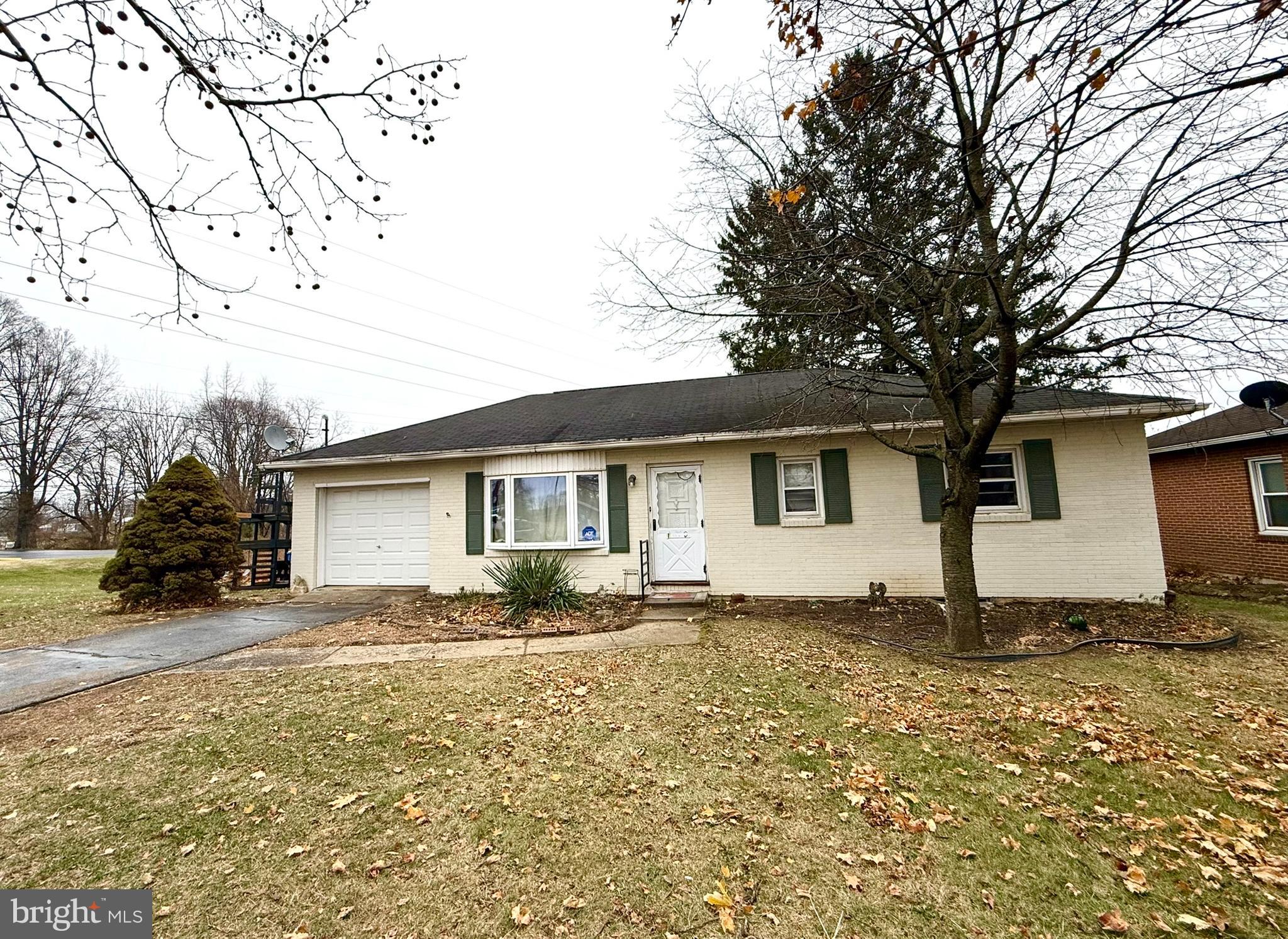 1020 Hanover Road York, PA 17408 - Photo 2 of 6 a white house that has a tree in front of it