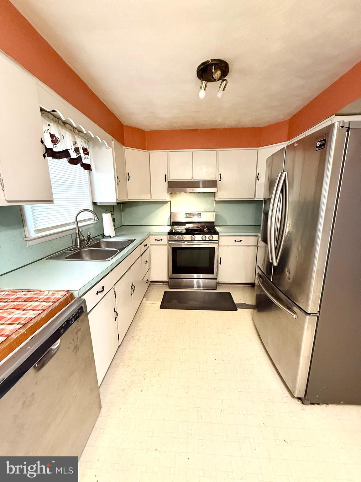1020 Hanover Road York, PA 17408 - Photo 3 of 6 a kitchen with stainless steel appliances granite countertop a sink refrigerator and microwave