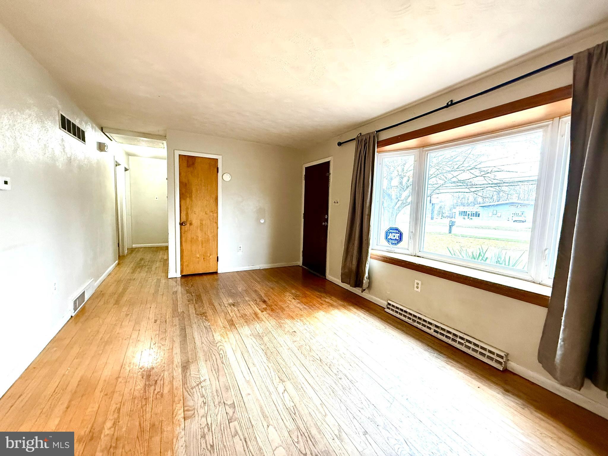 1020 Hanover Road York, PA 17408 - Photo 4 of 6 a view of a room with wooden floor and windows
