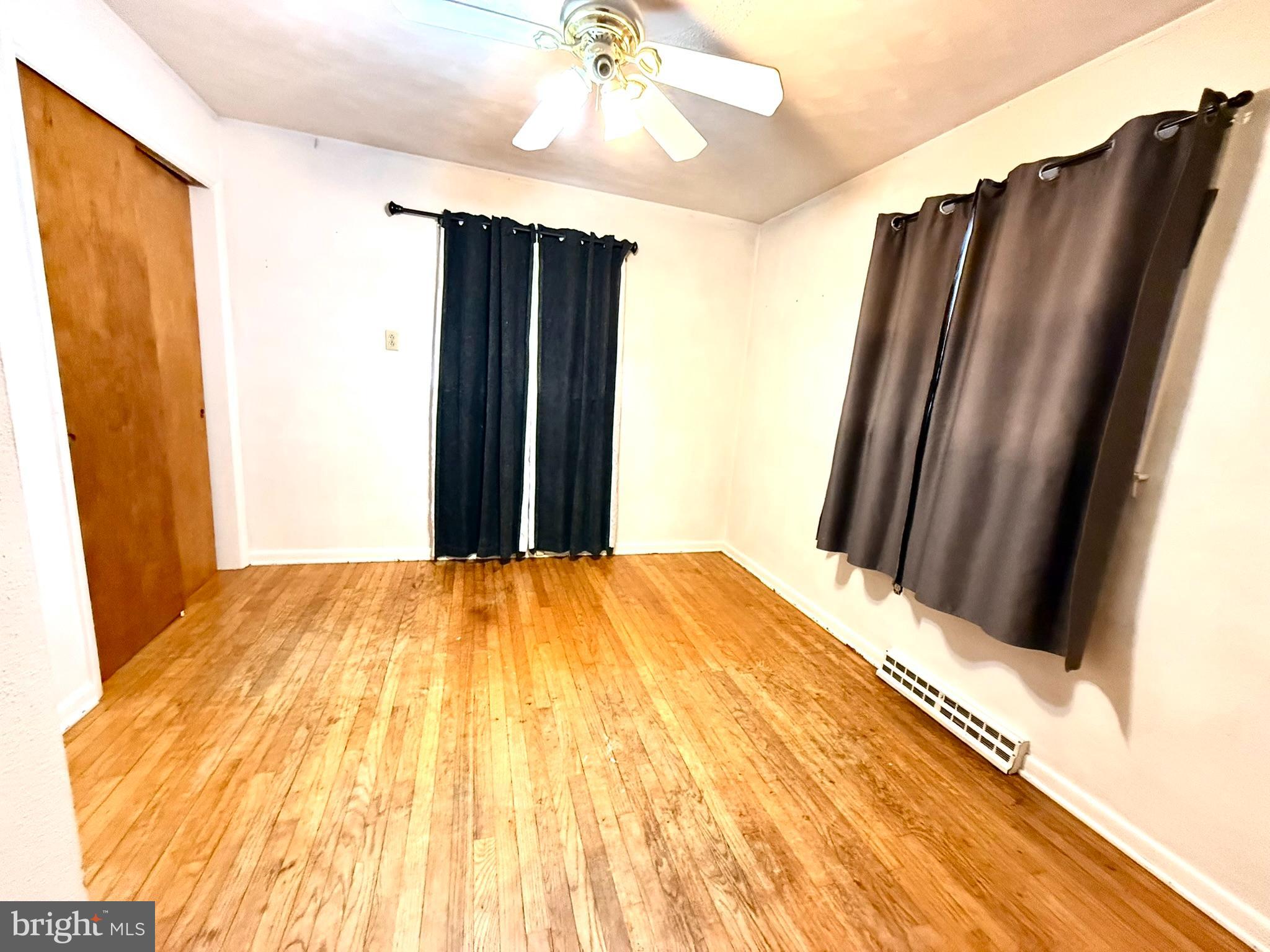 1020 Hanover Road York, PA 17408 - Photo 6 of 6 a bedroom with a bed and a mirror