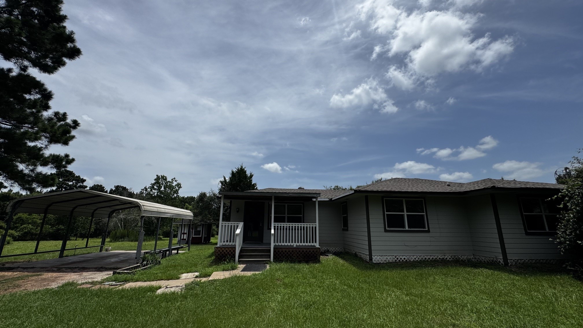 30827 Burton Cemetery Road Waller, TX 77484 - Photo 19 of 19 a view of a garden with an outdoor seating