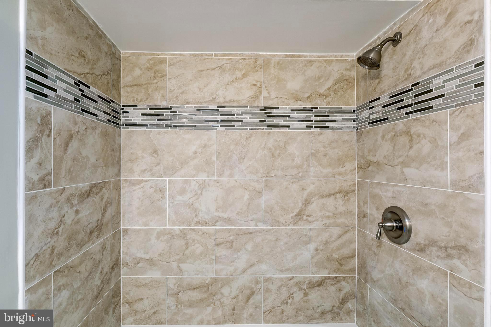1307 Kitmore Road Baltimore, MD 21239 - Photo 11 of 28 Gorgeous tile surround in basement tub shower