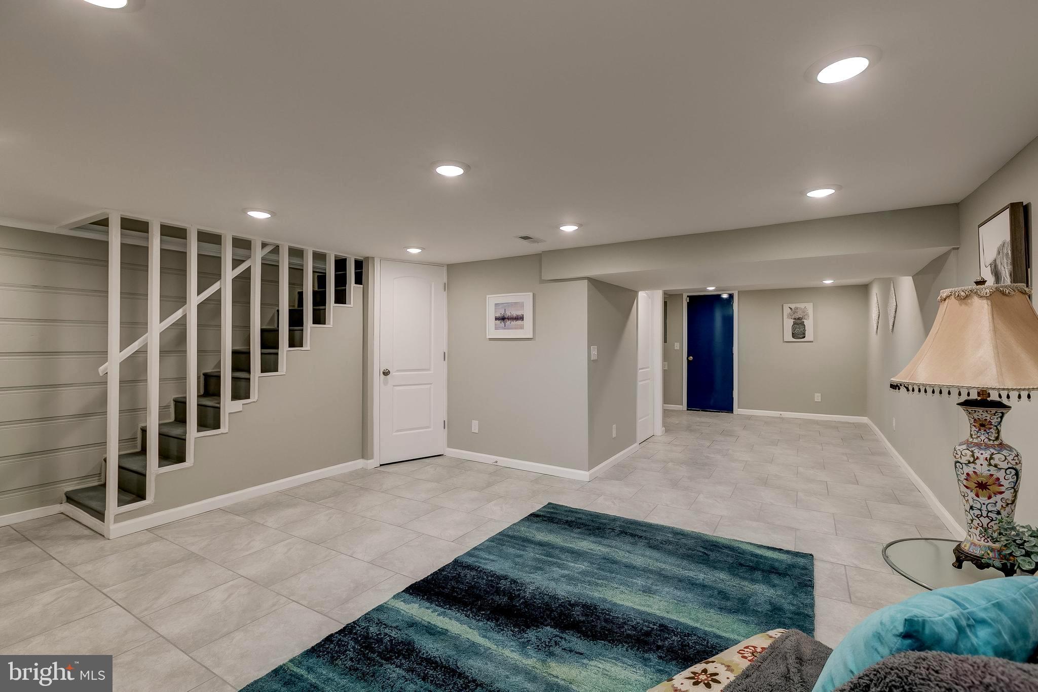 1307 Kitmore Road Baltimore, MD 21239 - Photo 23 of 28 Tile floor, recessed lighting, walk up bilco doors