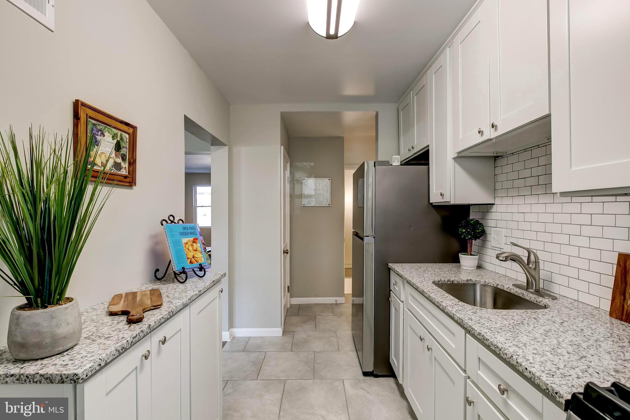 1307 Kitmore Road Baltimore, MD 21239 - Photo 9 of 28 Nice size pantry beyond the fridge