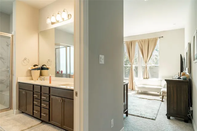 a bathroom with a double vanity sink and mirror