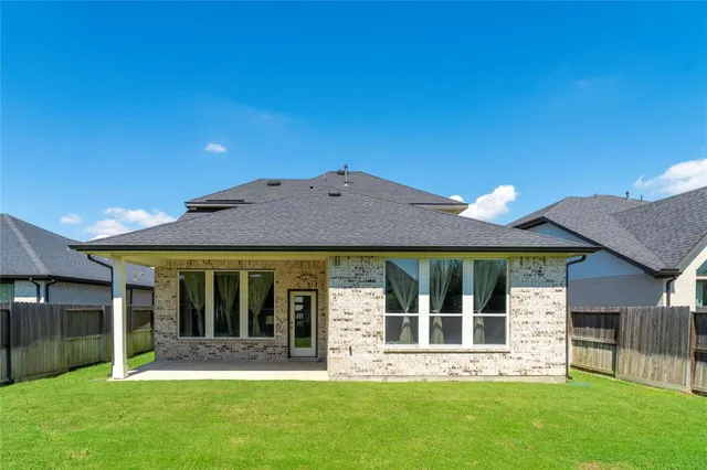 a view of a house with garden and porch