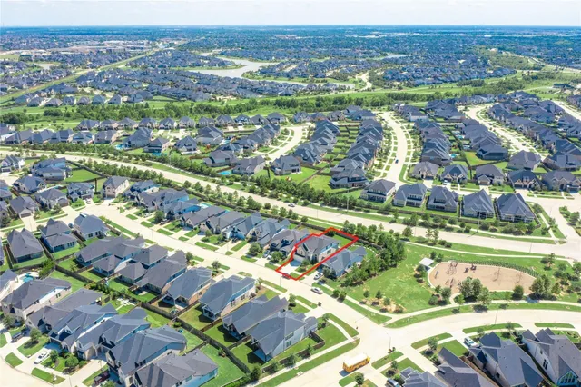an aerial view of residential building and lake view