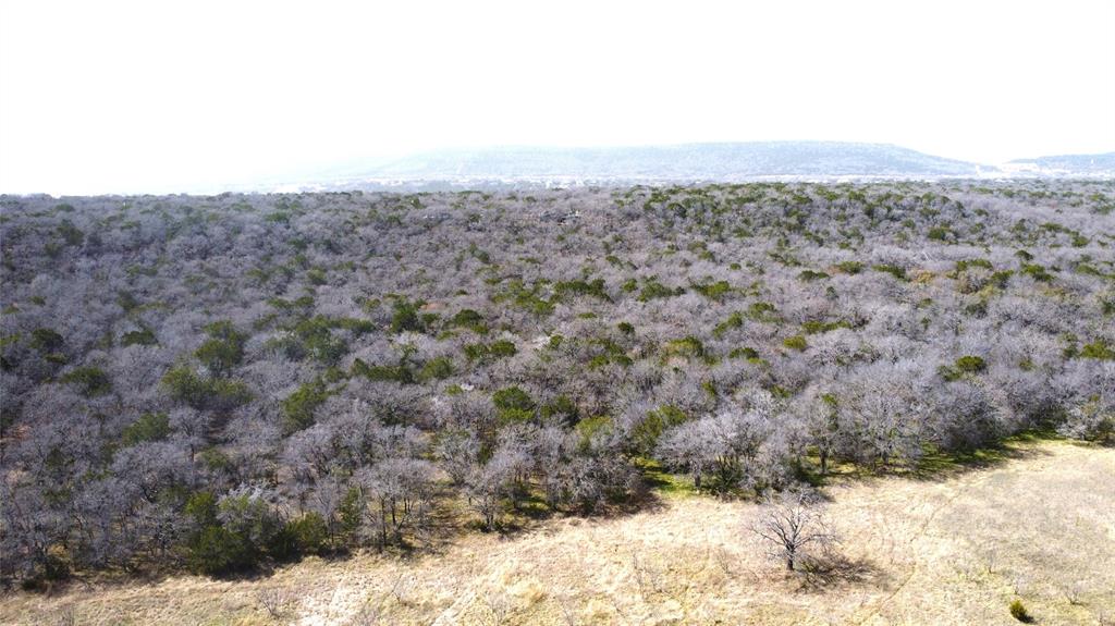 7789 White Tail Ridge Gordon, TX 76453 - Photo 11 of 34 a view of a dry yard covered with snow