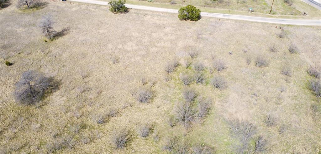 7789 White Tail Ridge Gordon, TX 76453 - Photo 15 of 34 a view of a dry yard with a road