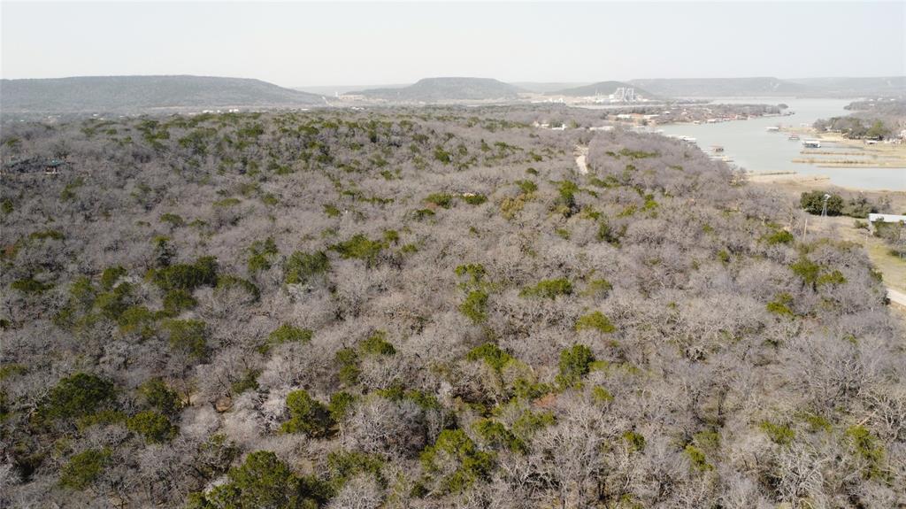 7789 White Tail Ridge Gordon, TX 76453 - Photo 19 of 34 a view of a mountain in the distance in a field