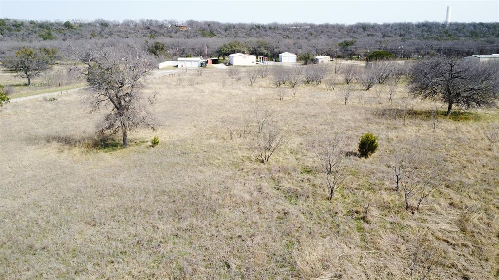 7789 White Tail Ridge Gordon, TX 76453 - Photo 32 of 34 a view of a dry yard with trees