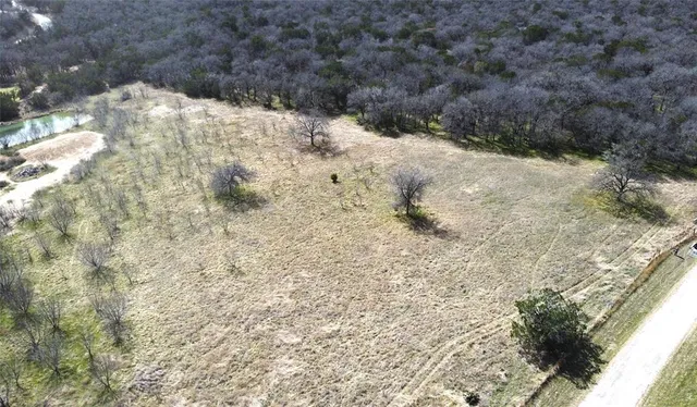 a view of a yard covered in snow