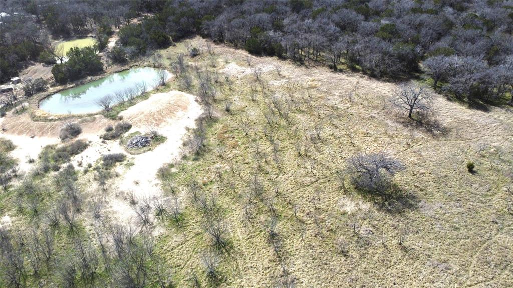 7789 White Tail Ridge Gordon, TX 76453 - Photo 7 of 34 a view of a yard covered with snow