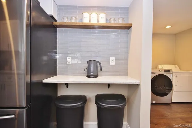 a bathroom with a sink and a washer dryer