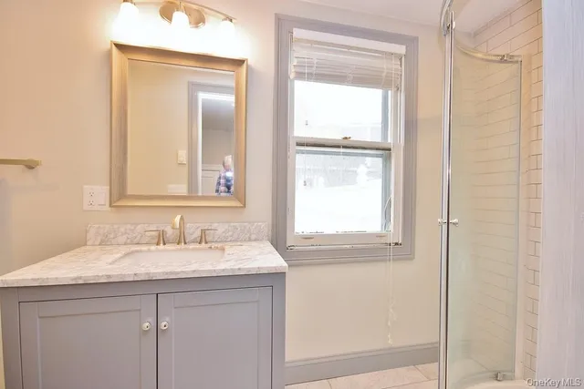 a bathroom with a sink and a mirror