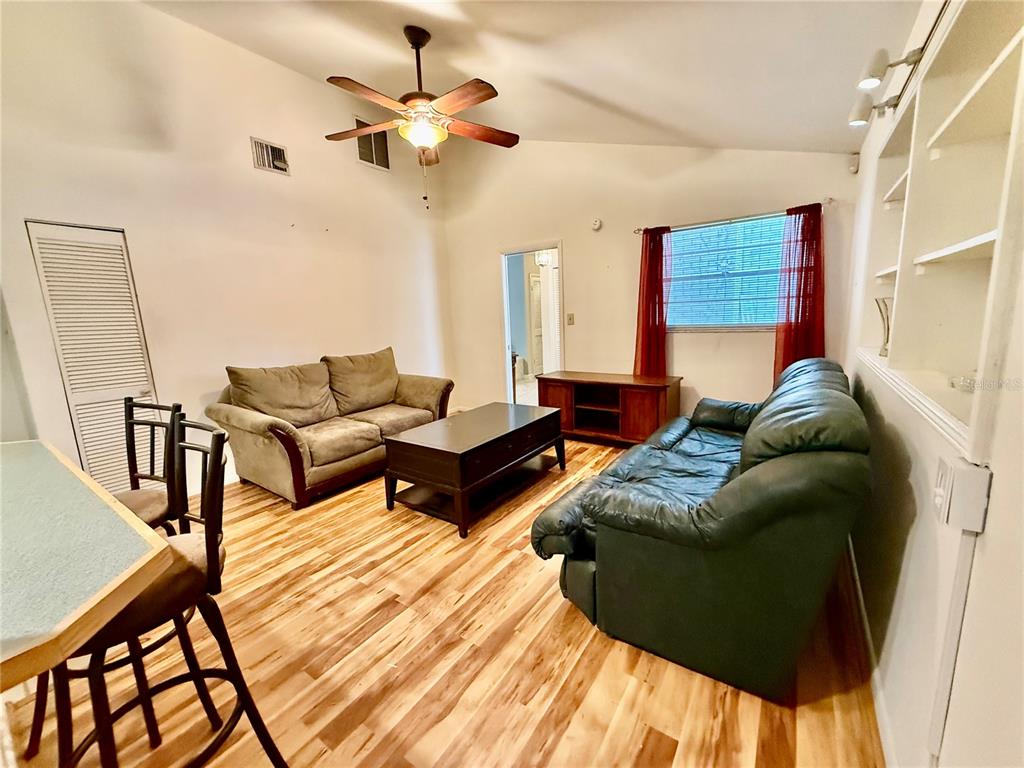 1004 Connecticut Road Tarpon Springs, FL 34689 - Photo 20 of 57 a living room with furniture and a rug