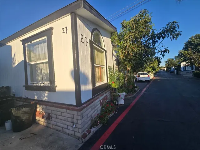 a front view of a house with outdoor space