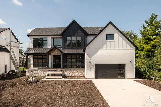 a front view of a house with garage