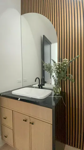 a bathroom with a sink and a mirror