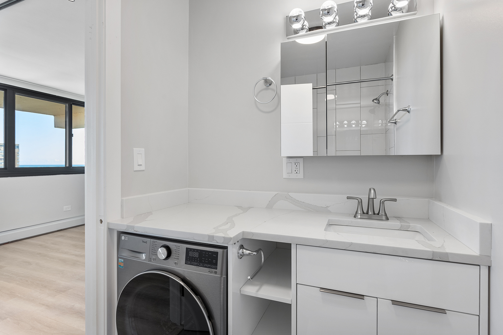 6166 North Sheridan Road, Unit 20D Chicago, IL 60660 - Photo 10 of 17 a utility room with cabinets washer and dryer