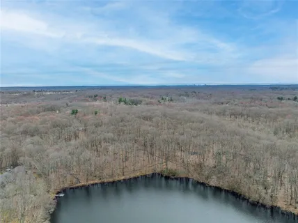 a backyard of a house with lots of trees