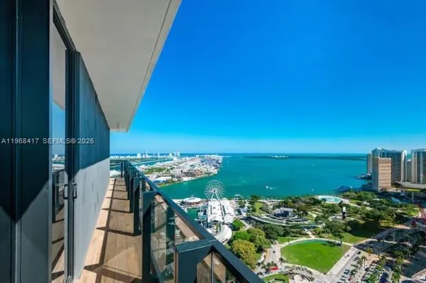 a view of a balcony with an ocean view