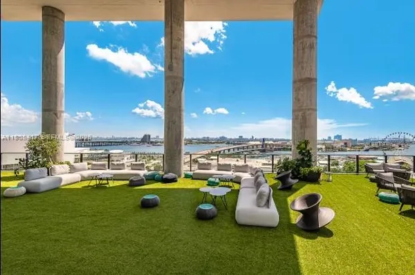 a view of a swimming pool and lounge chairs