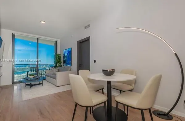 a view of a livingroom with furniture and a table