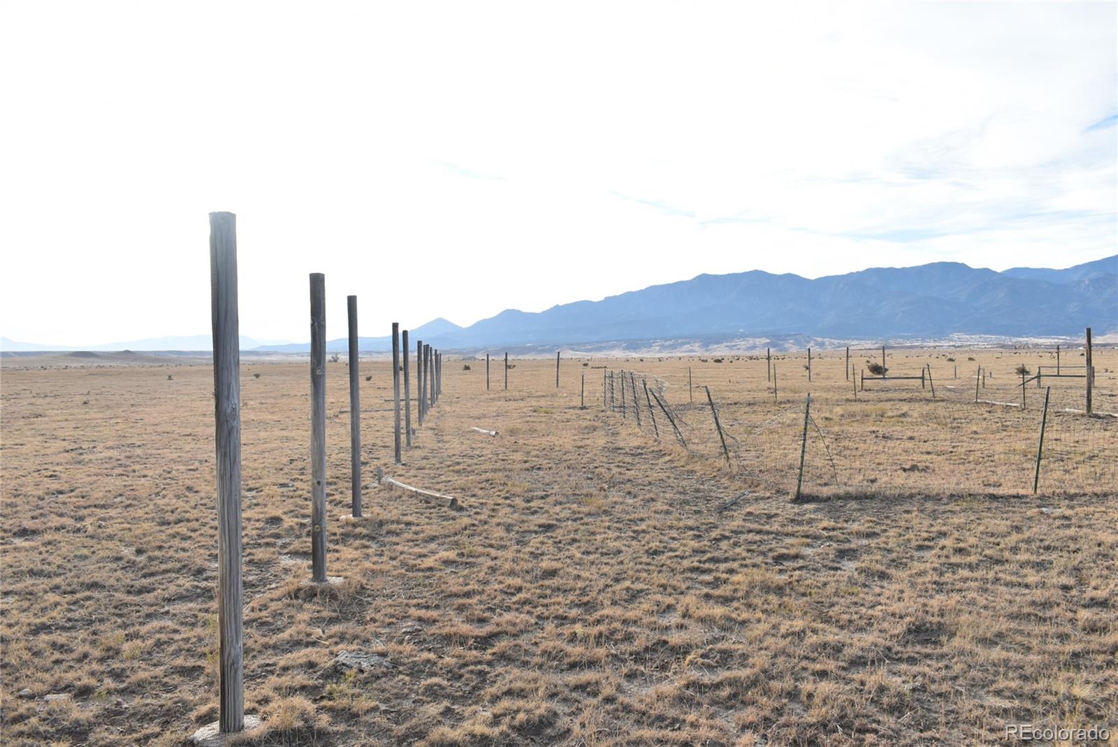Lot 35 Bennett Road Rye, CO 81069 - Photo 9 of 25 a view of an ocean with a building in the background