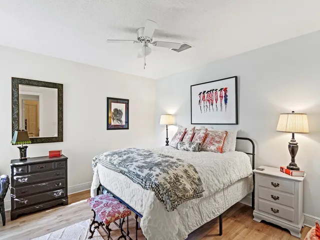 a bedroom with a bed and a dresser