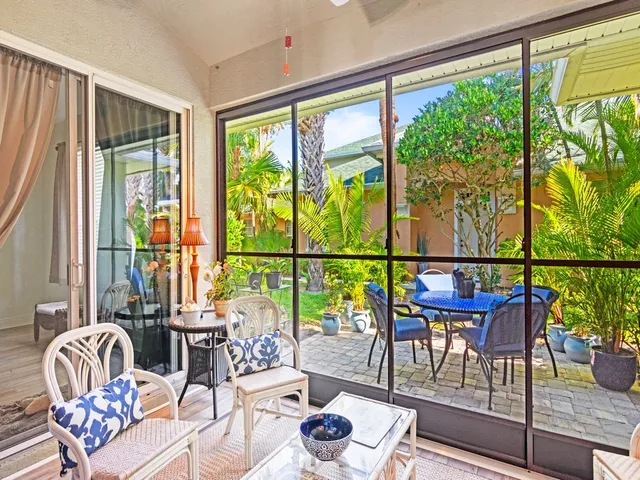 a living room with large windows