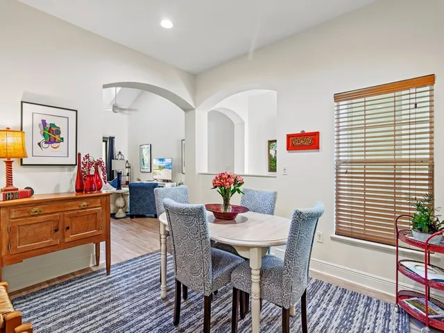 a view of a dining room with furniture and a window