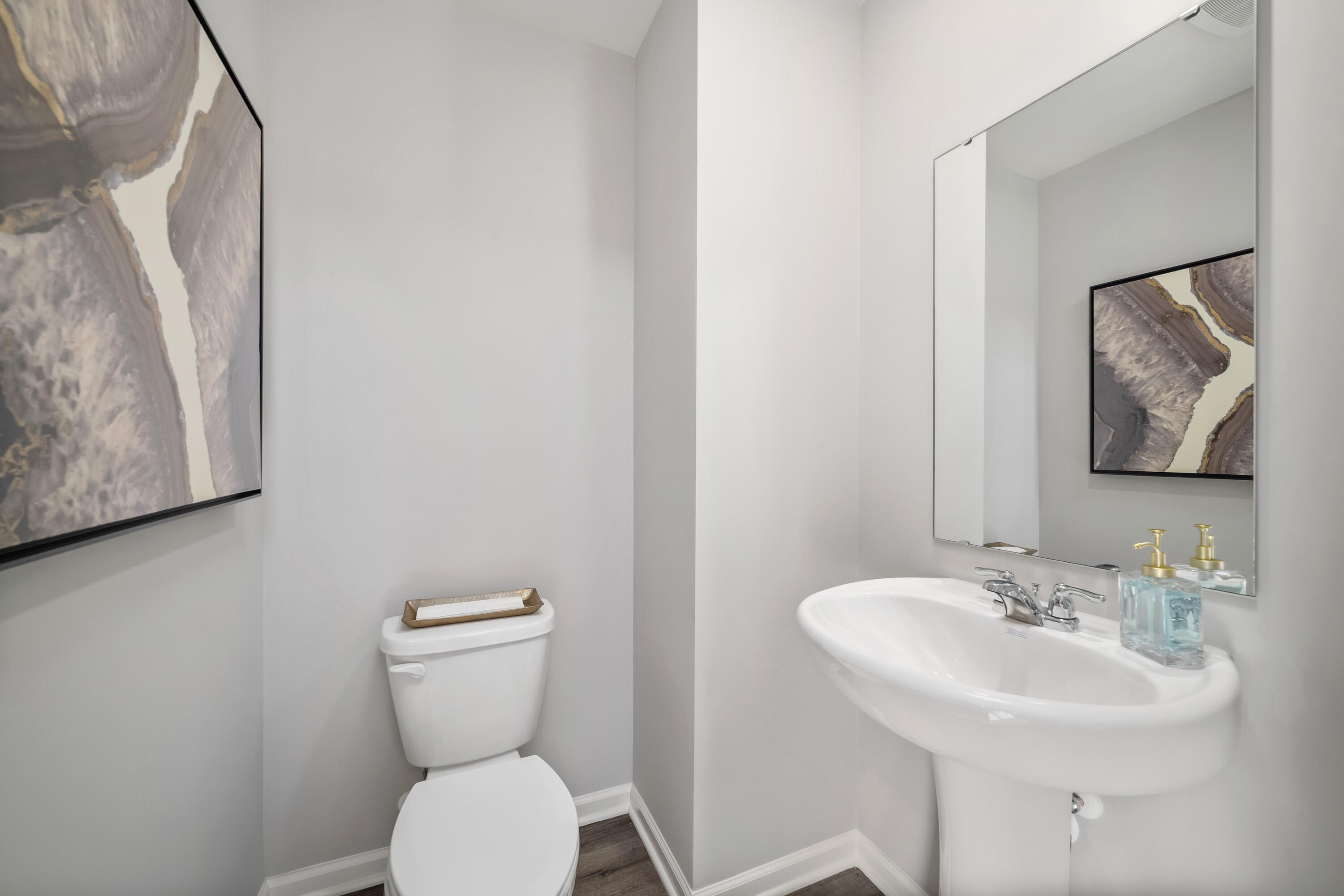 601 Petry Street Hebron, IN 46341 - Photo 18 of 44 a bathroom with a toilet sink and mirror