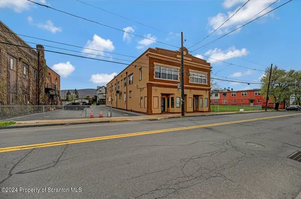 a view of a building with a street