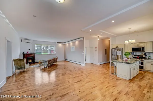 a white toilet sitting next to a bathroom sink and vanity