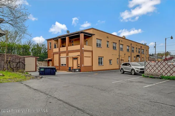 a view of a building with a street
