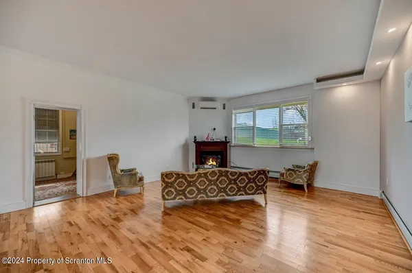 a view of a dining room with furniture and a window
