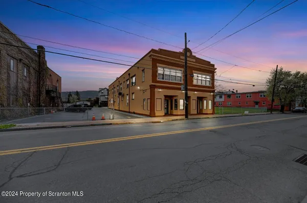 a view of a building with a street