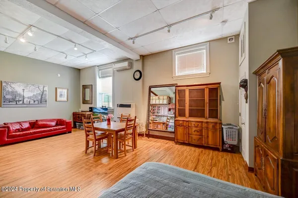 a kitchen with granite countertop a sink stove and cabinets