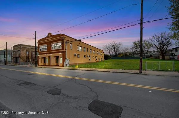 a black and white photo of a bench