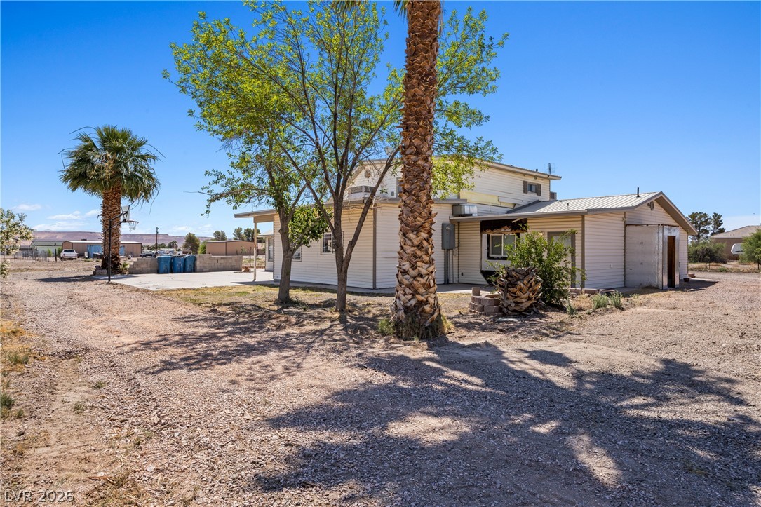 750 Leming Avenue Overton, NV 89040 - Photo 73 of 82 This property features a spacious yard and functional outbuildings, perfect for various needs.