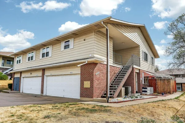 a view of a house with snow on the wall
