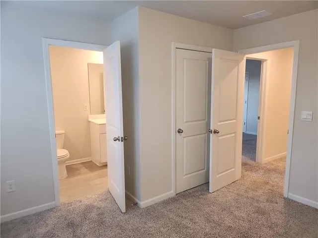 a view of a bathroom with a glass door and a bathroom