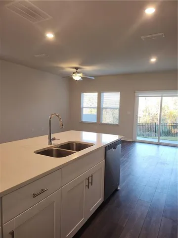 a kitchen with sink and window