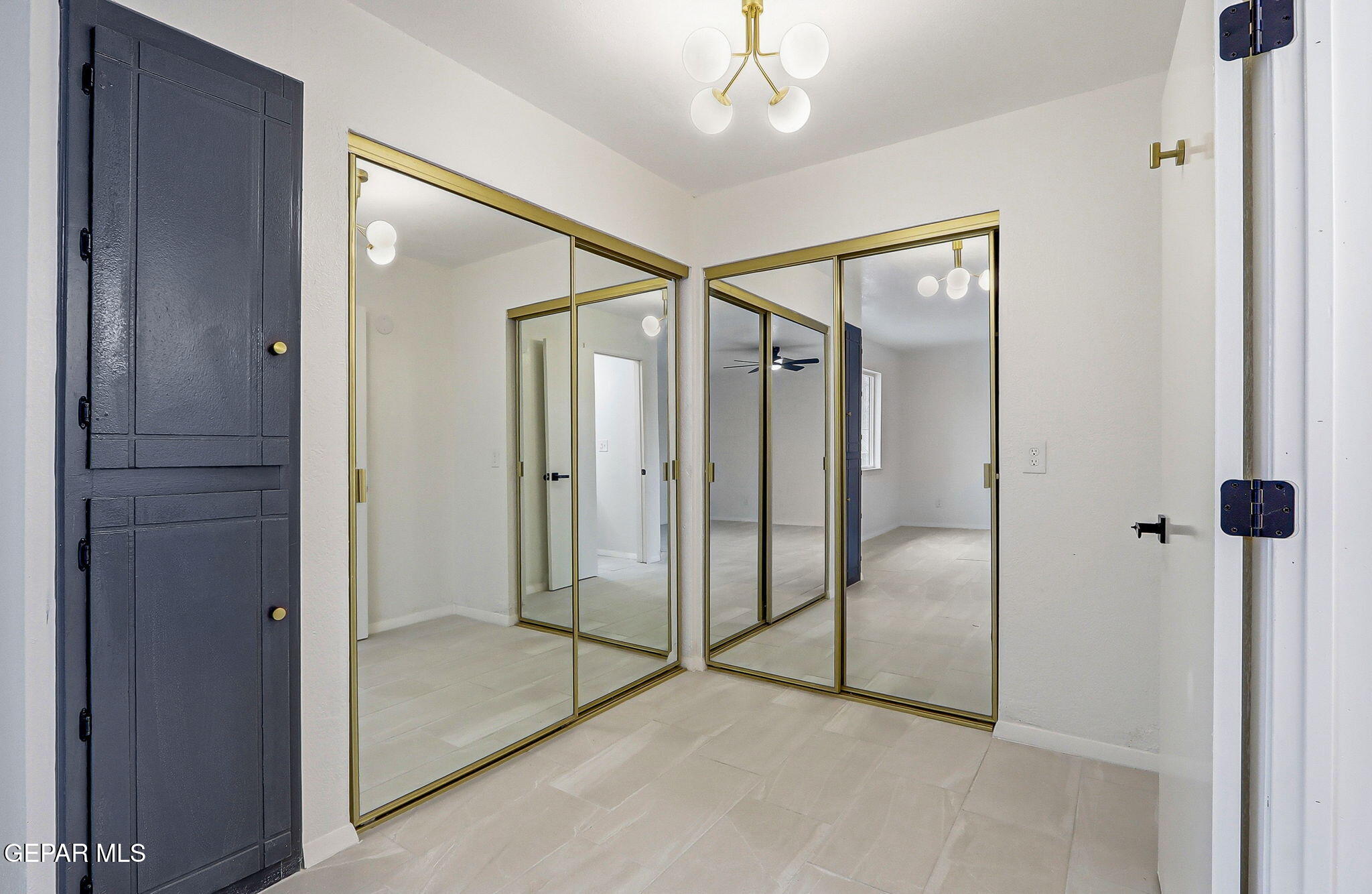 709 Frontera Road El Paso, TX 79922 - Photo 38 of 41 a view of a bathroom with a glass shower door and a mirror