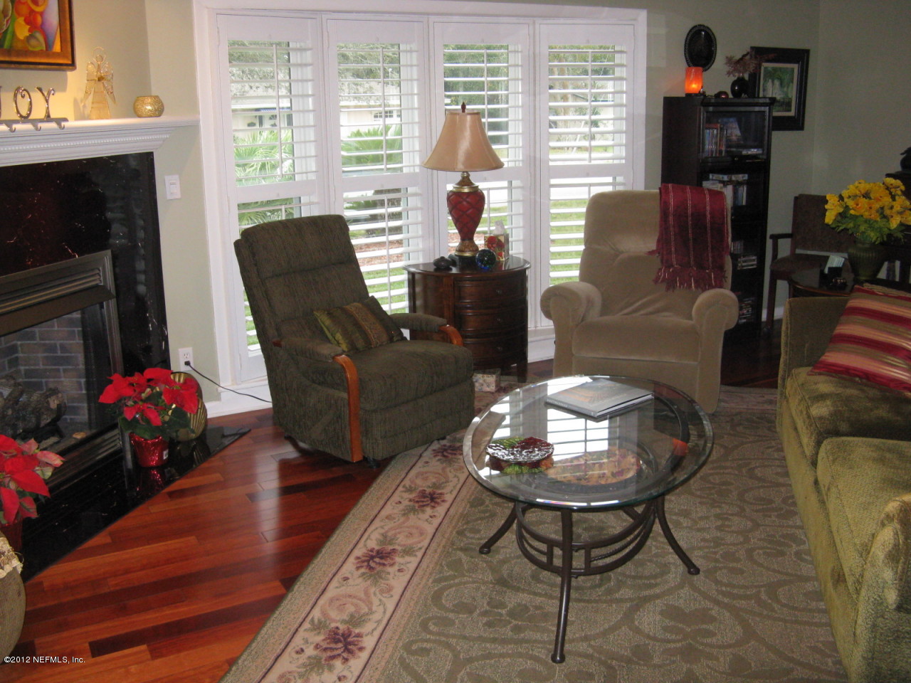 629 Segovia Road St. Augustine, FL 32086 - Photo 12 of 21 a living room with furniture and a fireplace