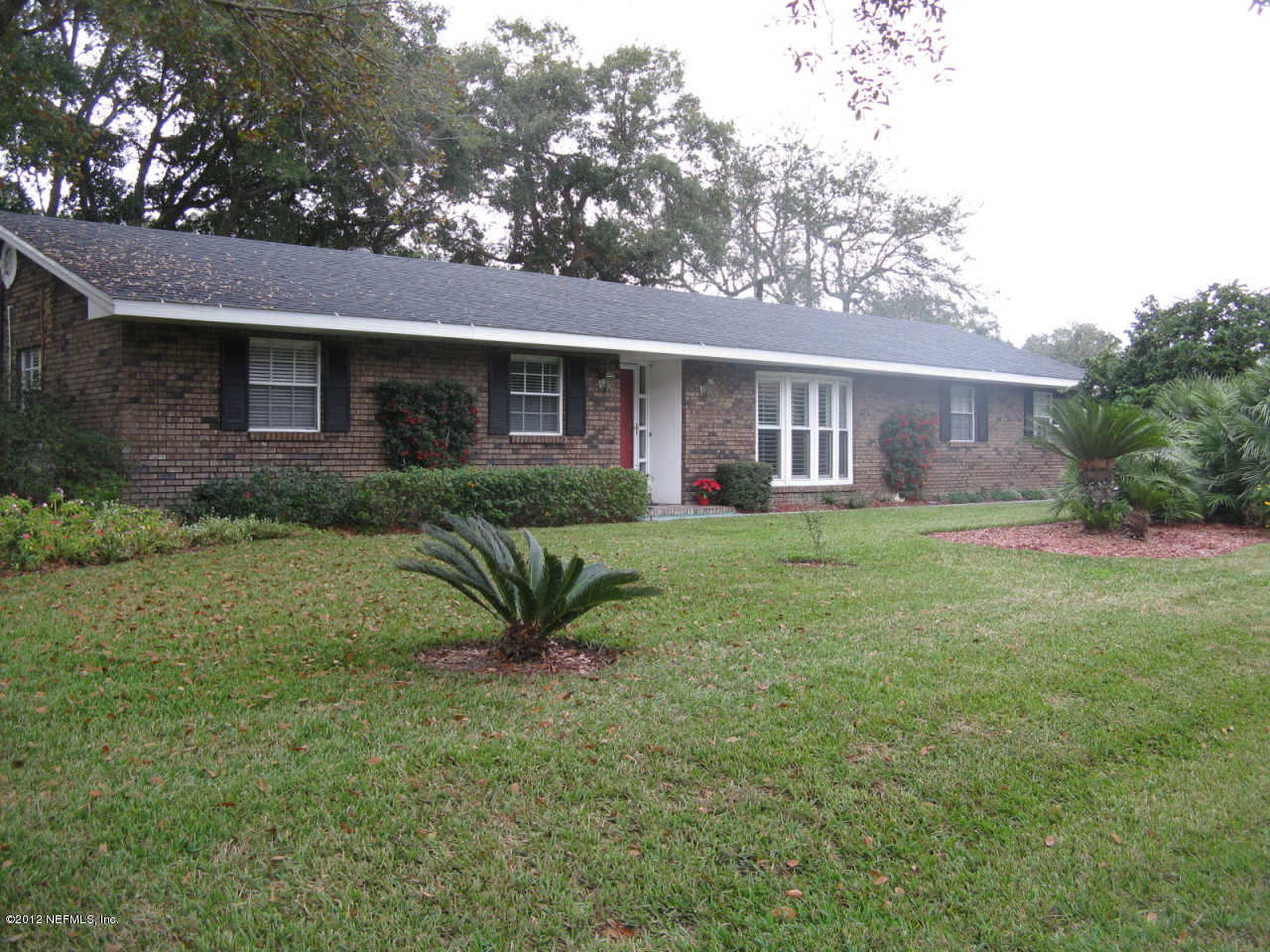 629 Segovia Road St. Augustine, FL 32086 - Photo 3 of 21 a house view with a garden space