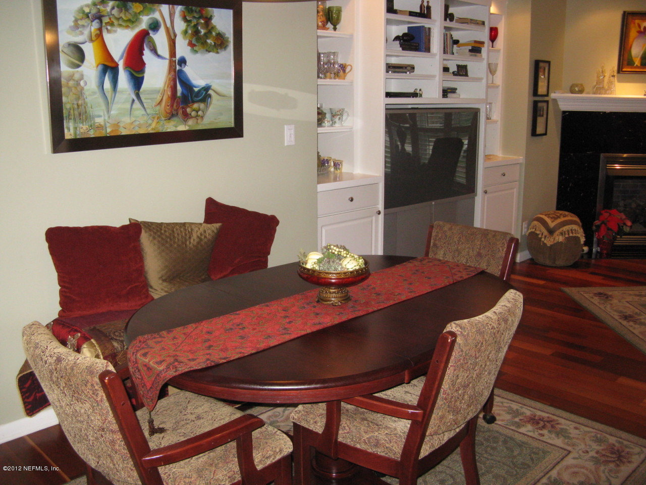 629 Segovia Road St. Augustine, FL 32086 - Photo 10 of 21 a view of a dining room with furniture wooden floor and a fireplace